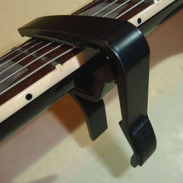 Каподастр Dunlop 83CB Trigger Capo Acoustic Curved Black